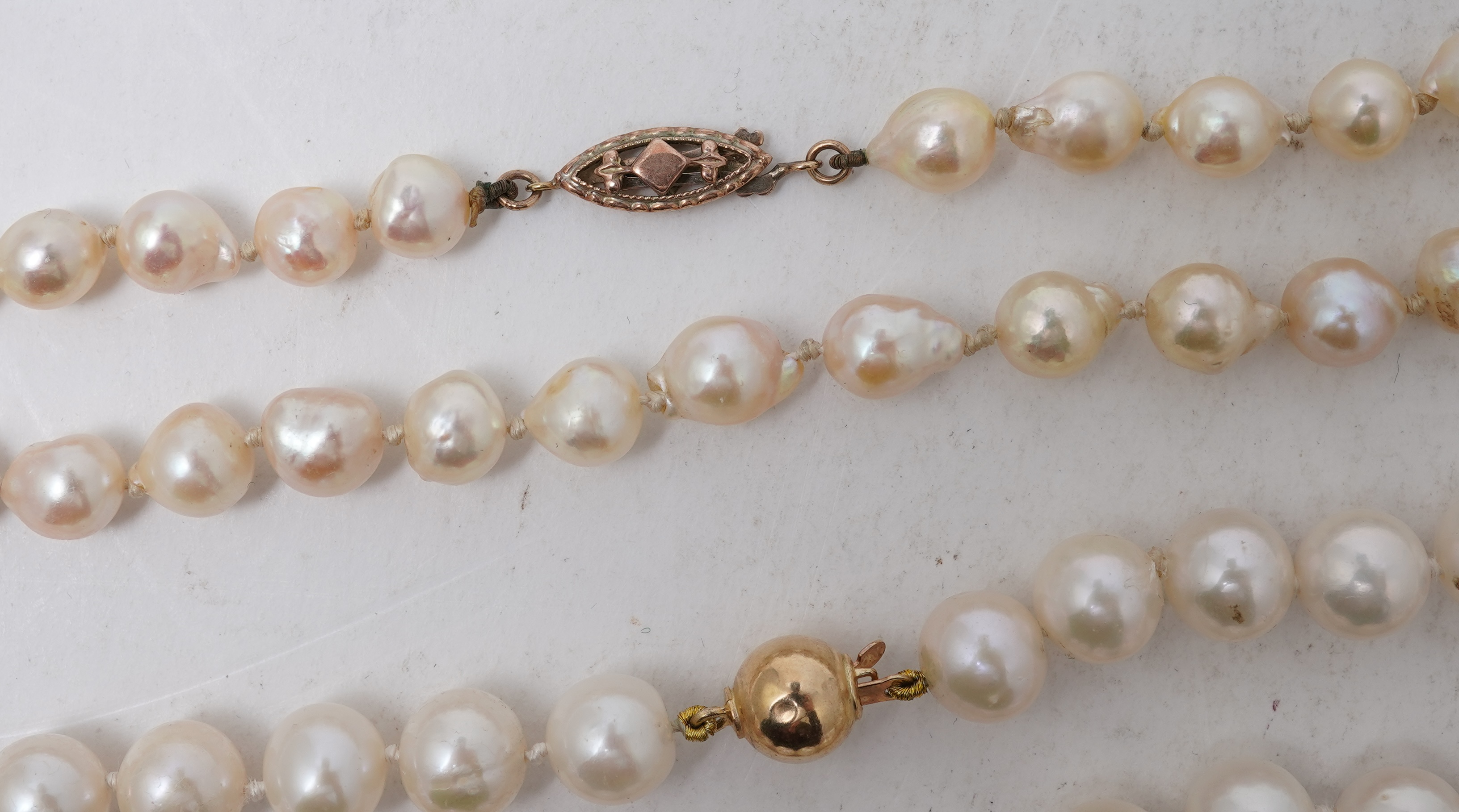 A collection of four cultured pearl necklaces